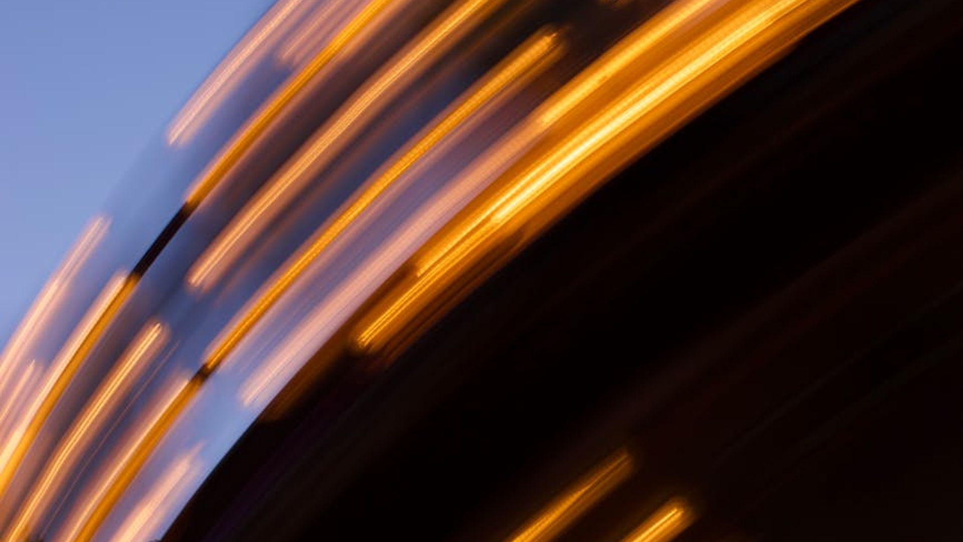 Abstract dark background with mint-colored light trails.